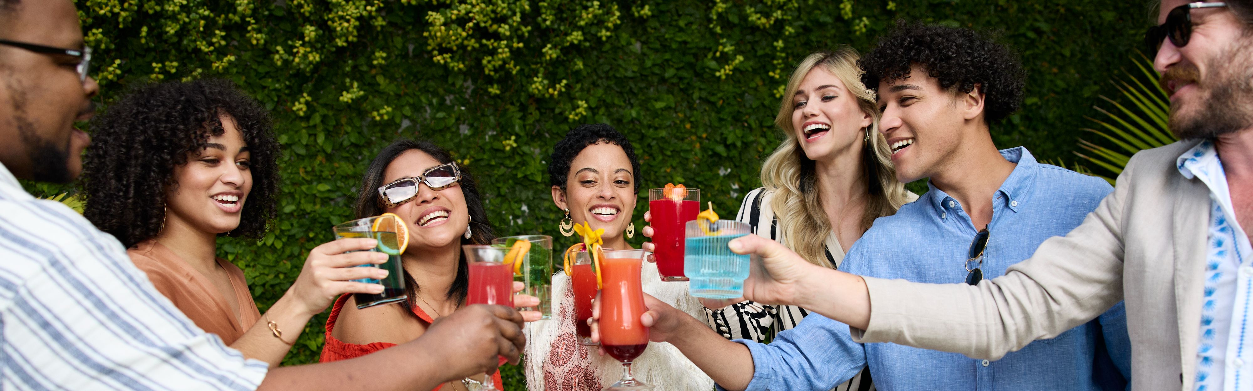 Friends enjoying cocktails in the garden courtyard.