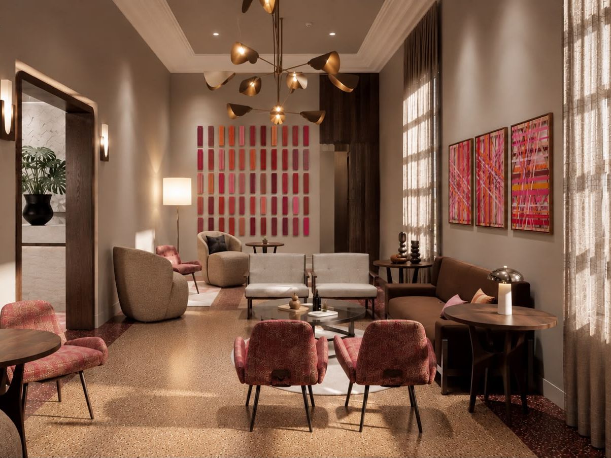 Elegant lobby lounge seating with modern artwork and warm, natural light.
