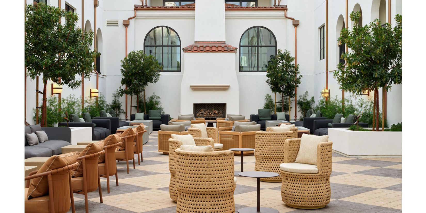 Rooftop pool with lounge chairs and umbrellas
