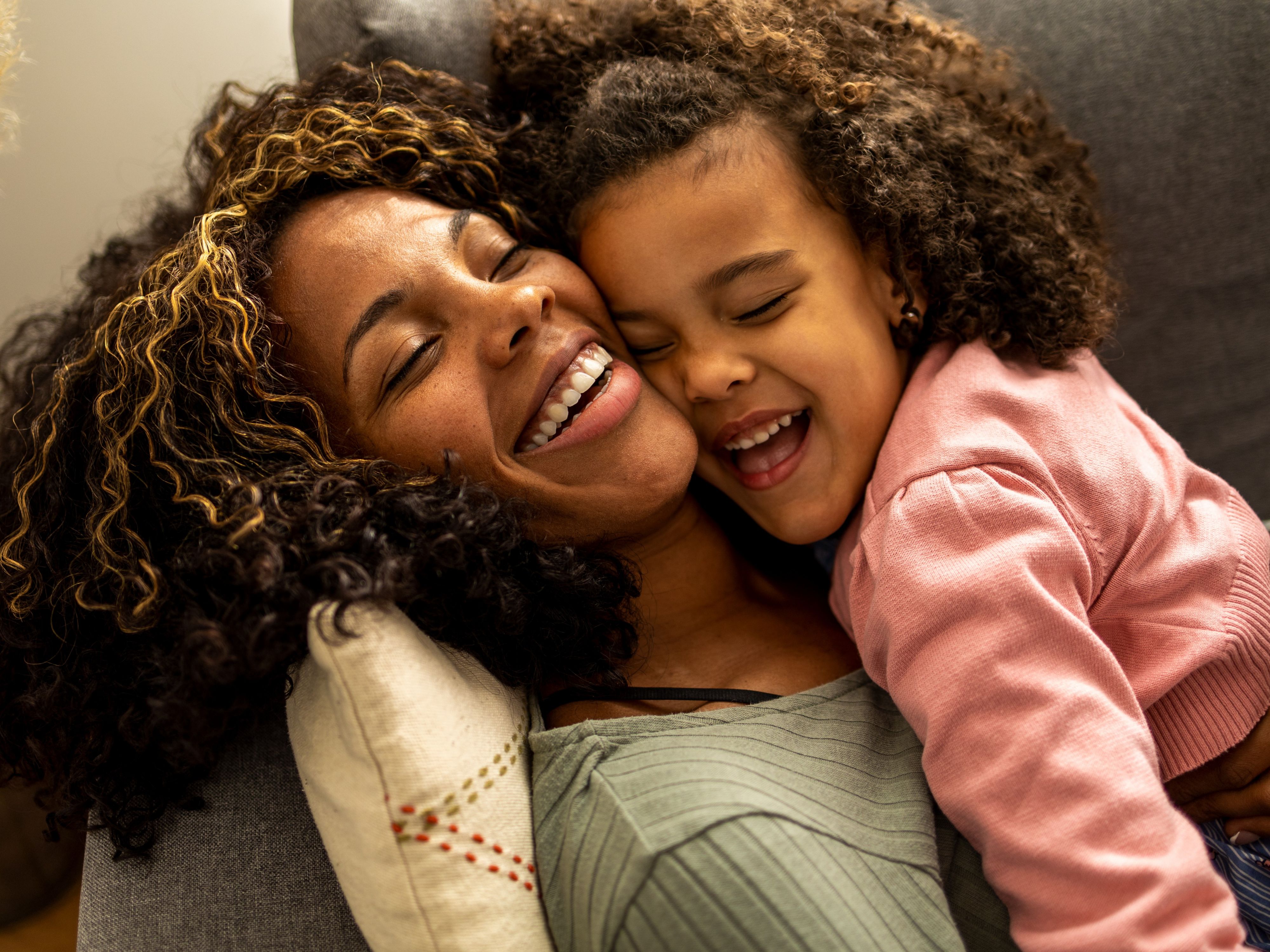 Mother and daughter laughing together