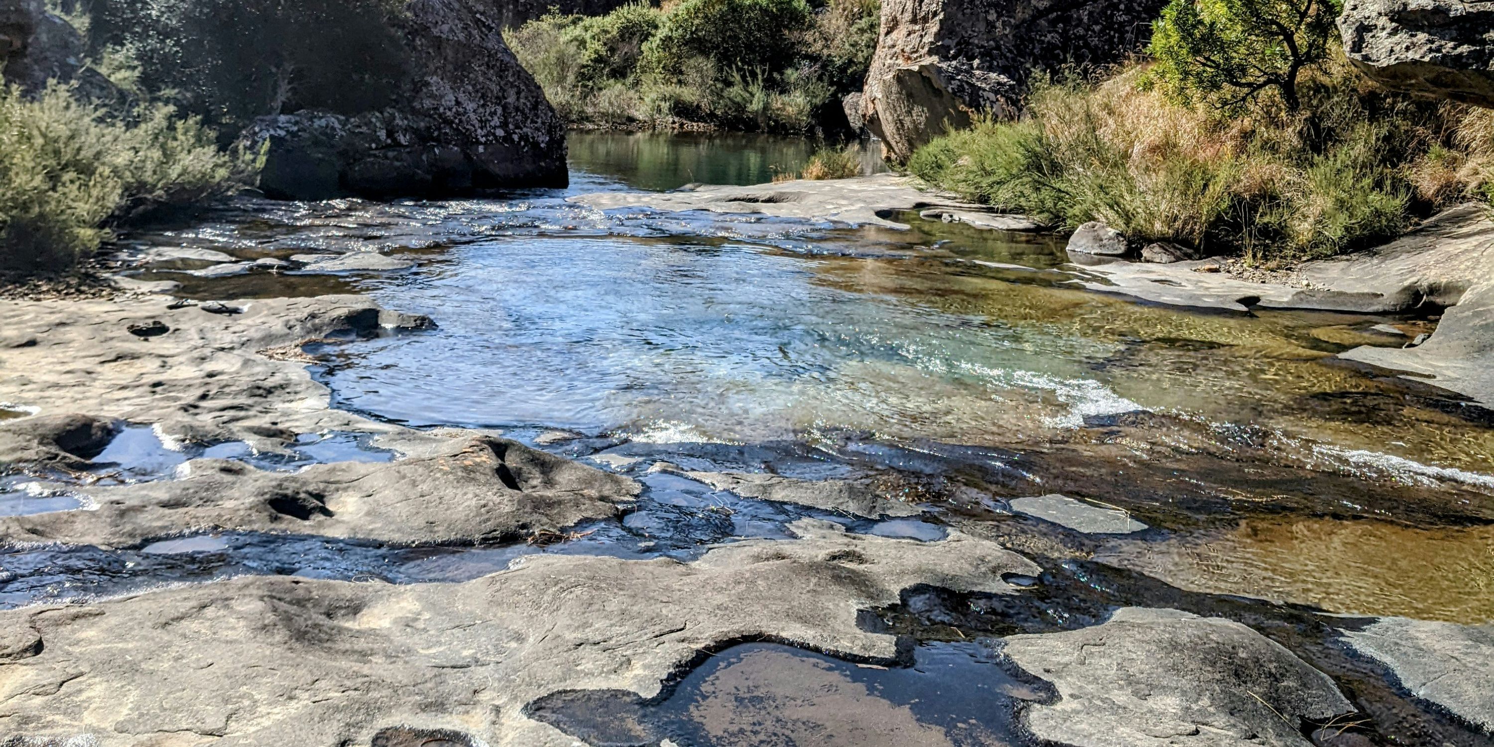 Creek running through mountains.