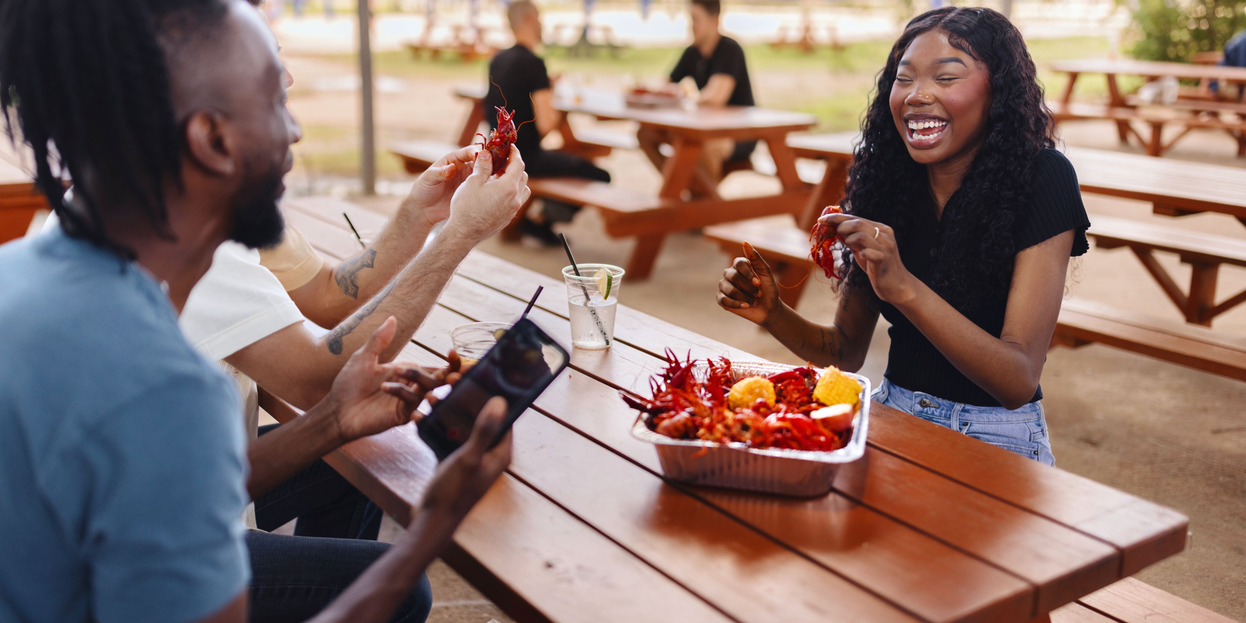 Friends eating crawfish