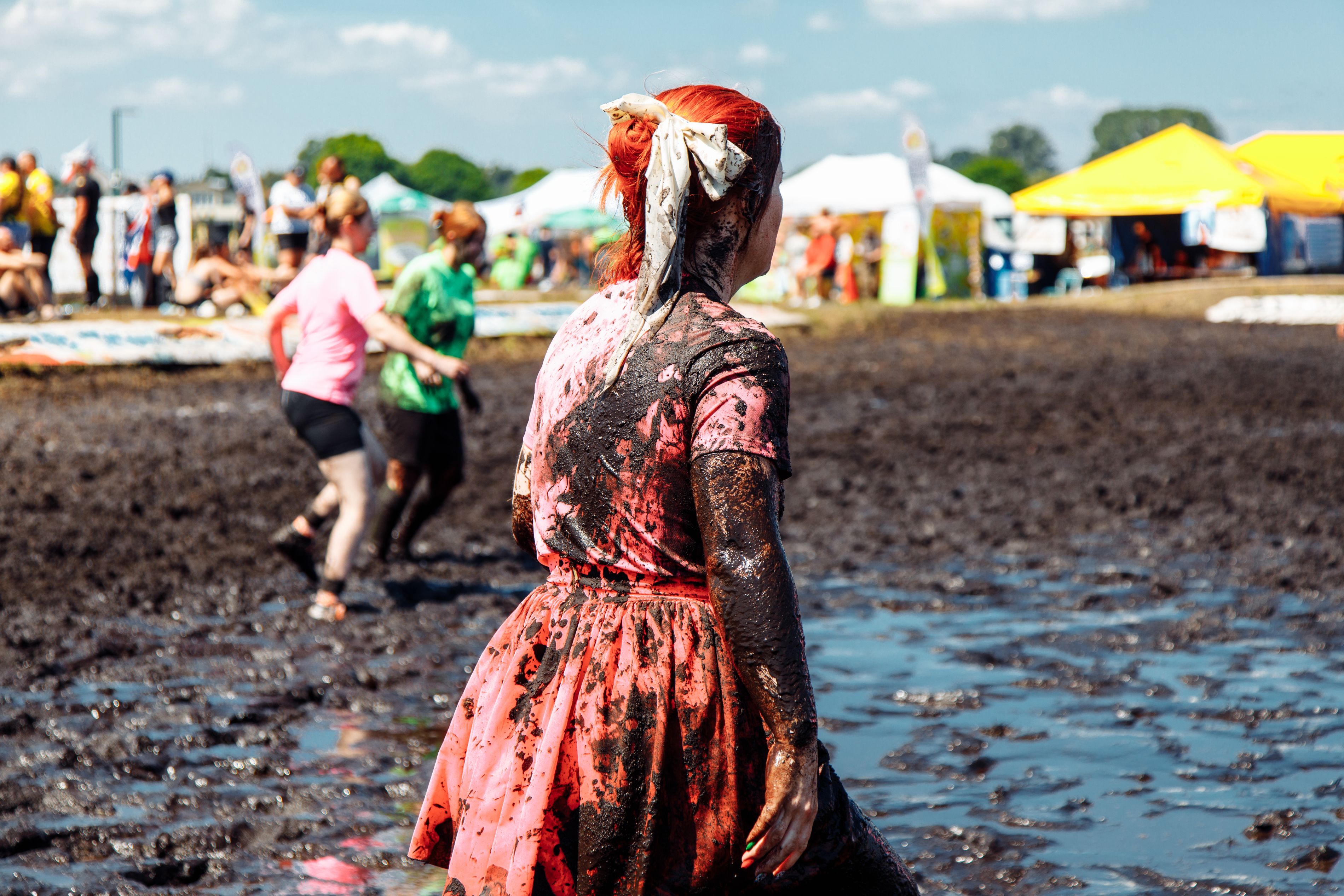 Woman participating in the Mudbowl.