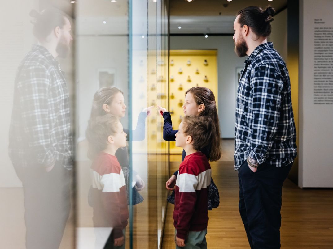 Family walking through museum