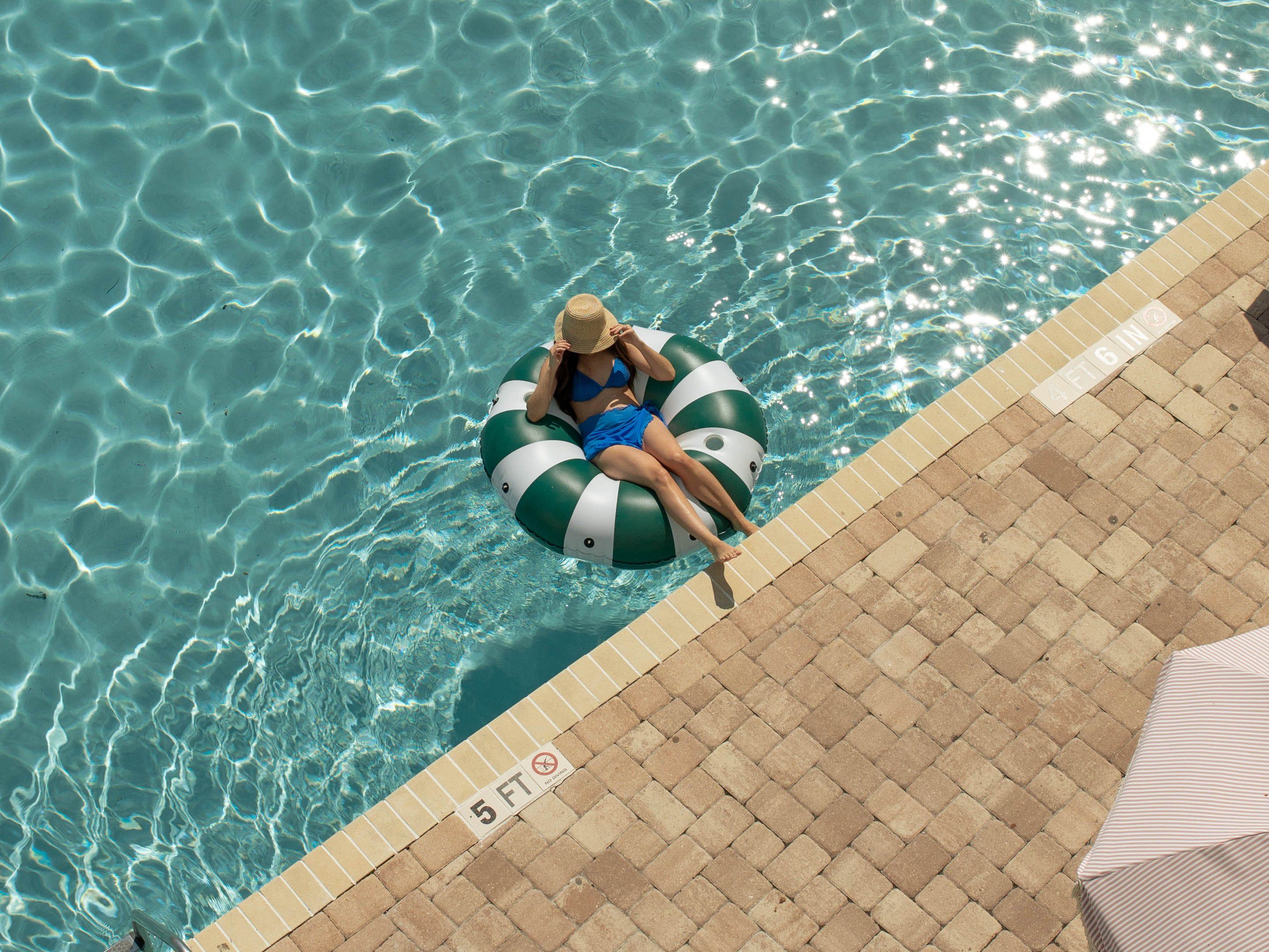 Family enjoying their vacation in the pool