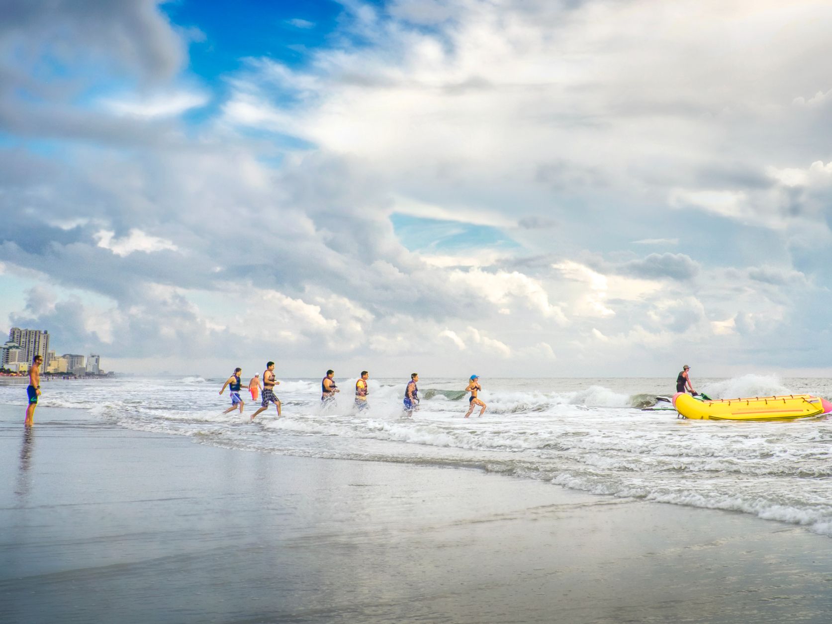 Families playing on beach 