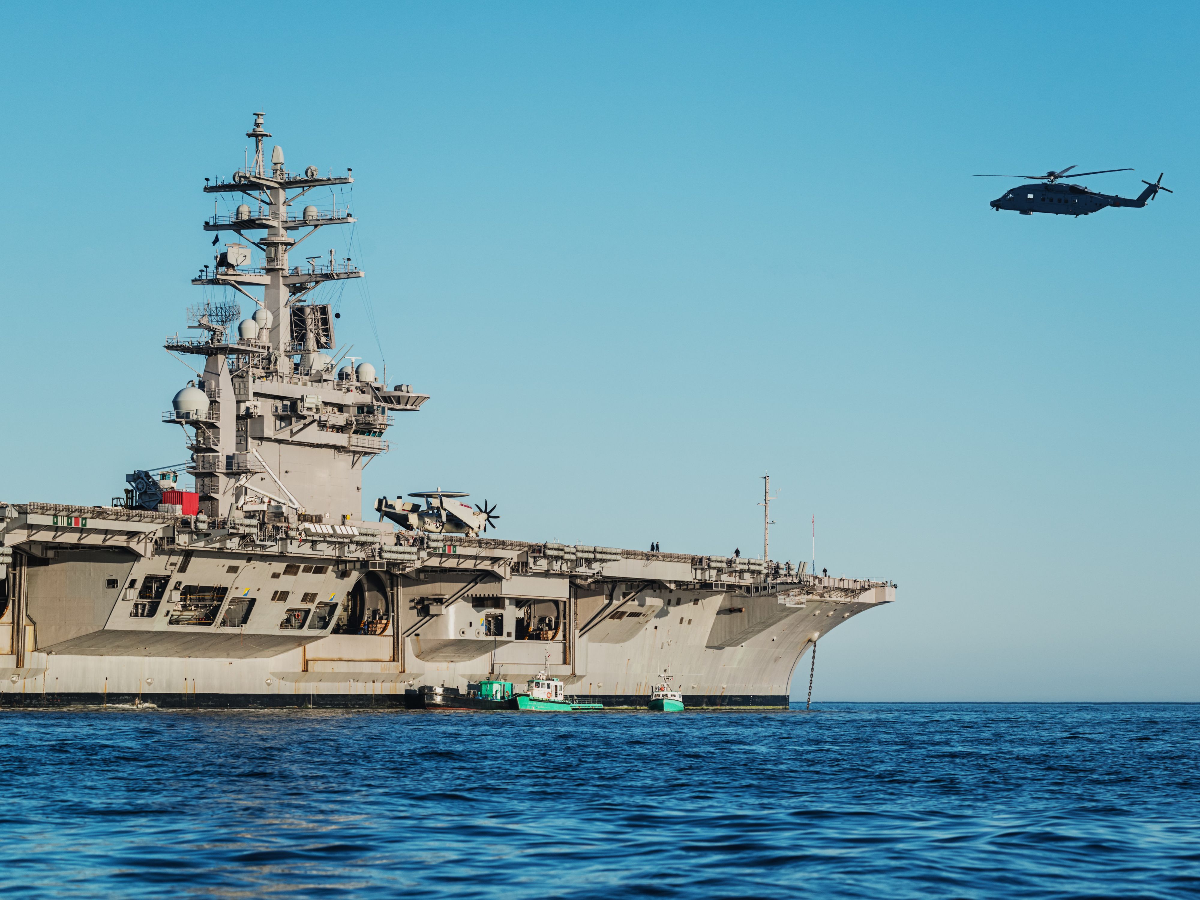 Navy ship and helicopter on the ocean
