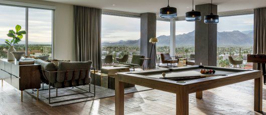 A recreational hotel lobby with a billiards table