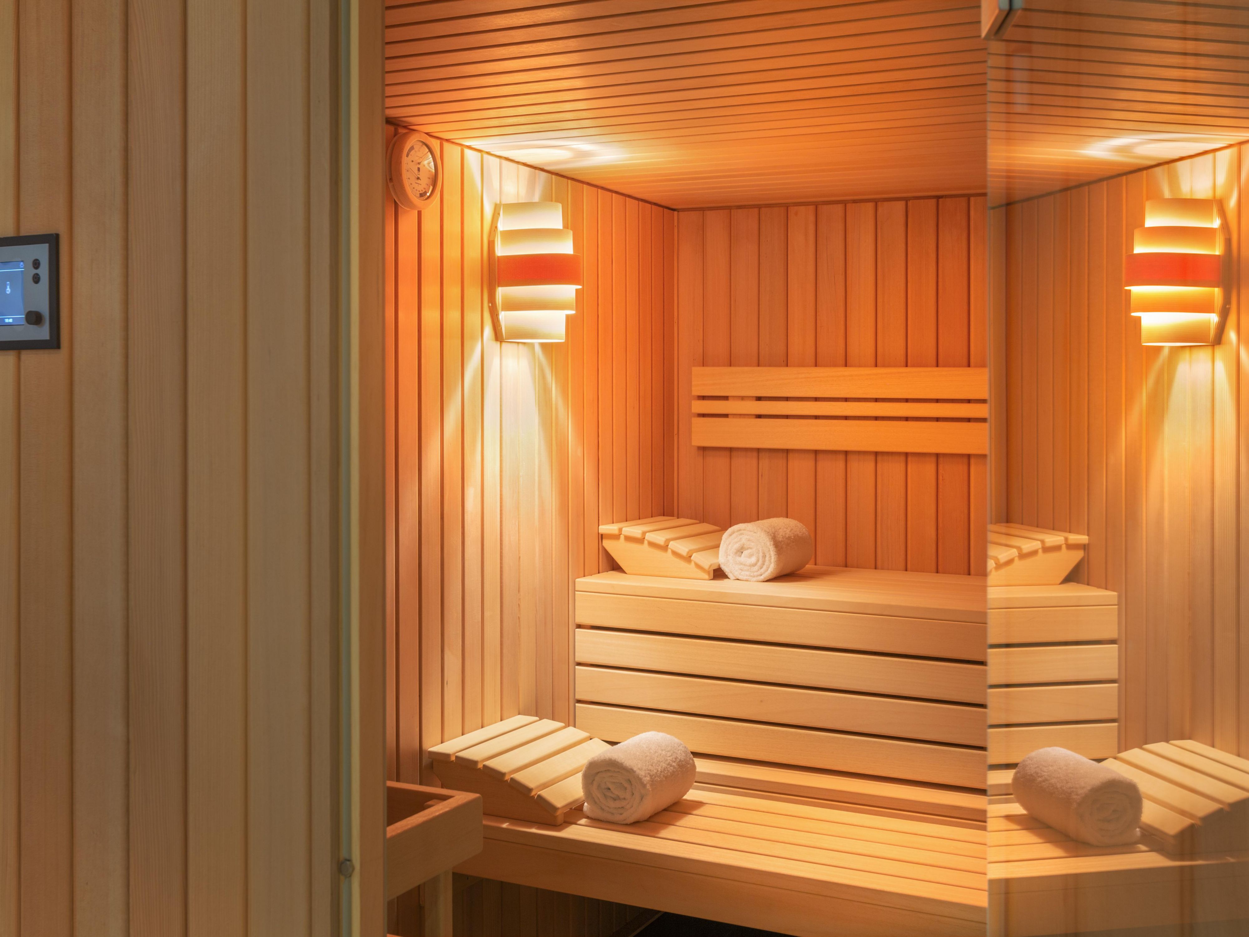 Unwind in our rooftop sauna, a serene space designed for relaxation. Enjoy the warmth and calm as you let go of the day's stress. Refresh yourself with a drink and take a moment for yourself in this peaceful environment. It's the perfect way to recharge and find balance during your stay.