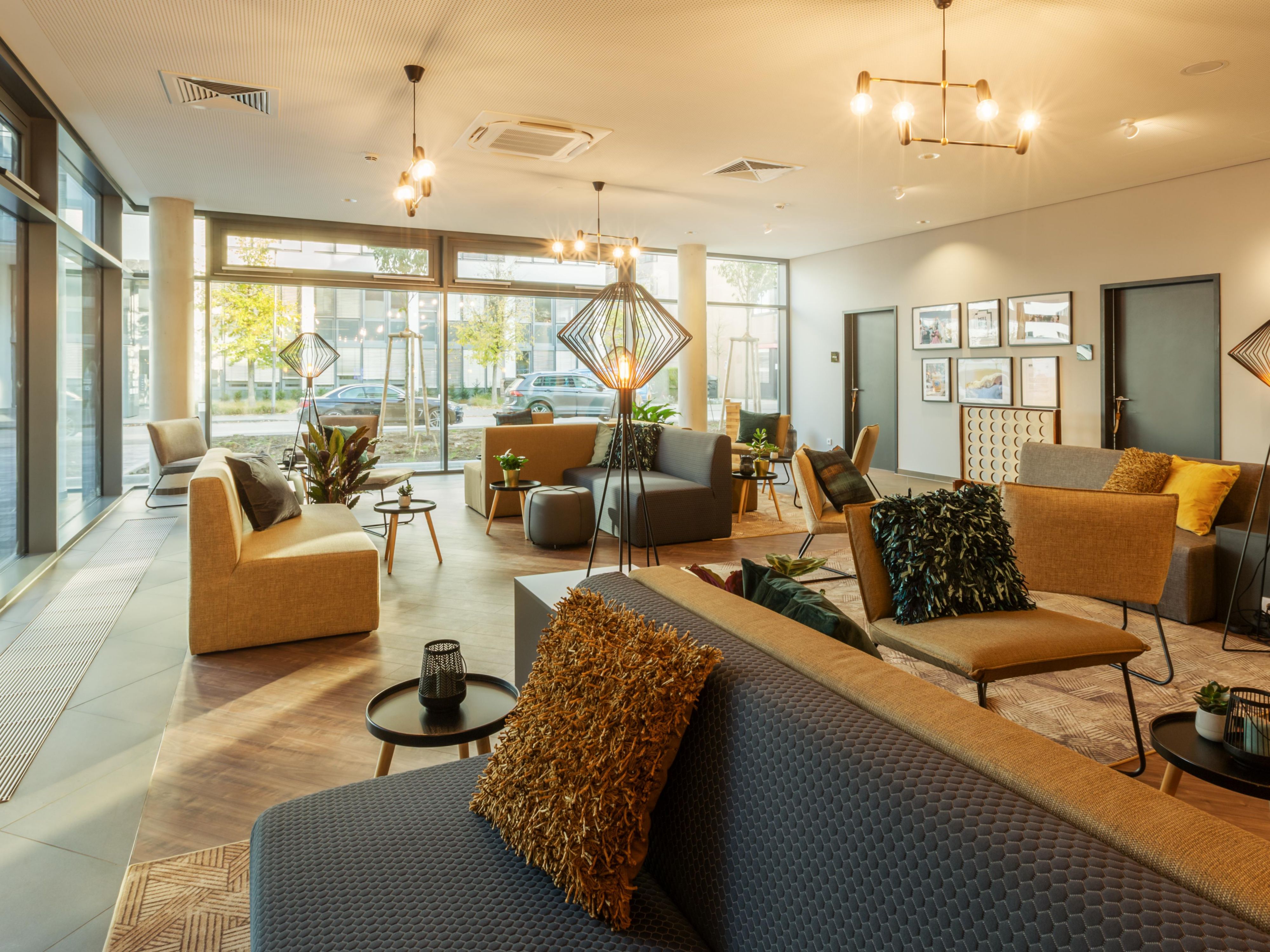 Our Living Lobby offers a bright, cozy, and inviting space – perfect for unwinding or productive work. With plenty of power outlets and high-speed Wi-Fi, it’s the ideal spot to relax, meet others, or network.