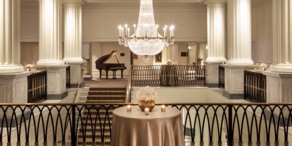 Grand hallway with chandelier at IC New York Barclay.