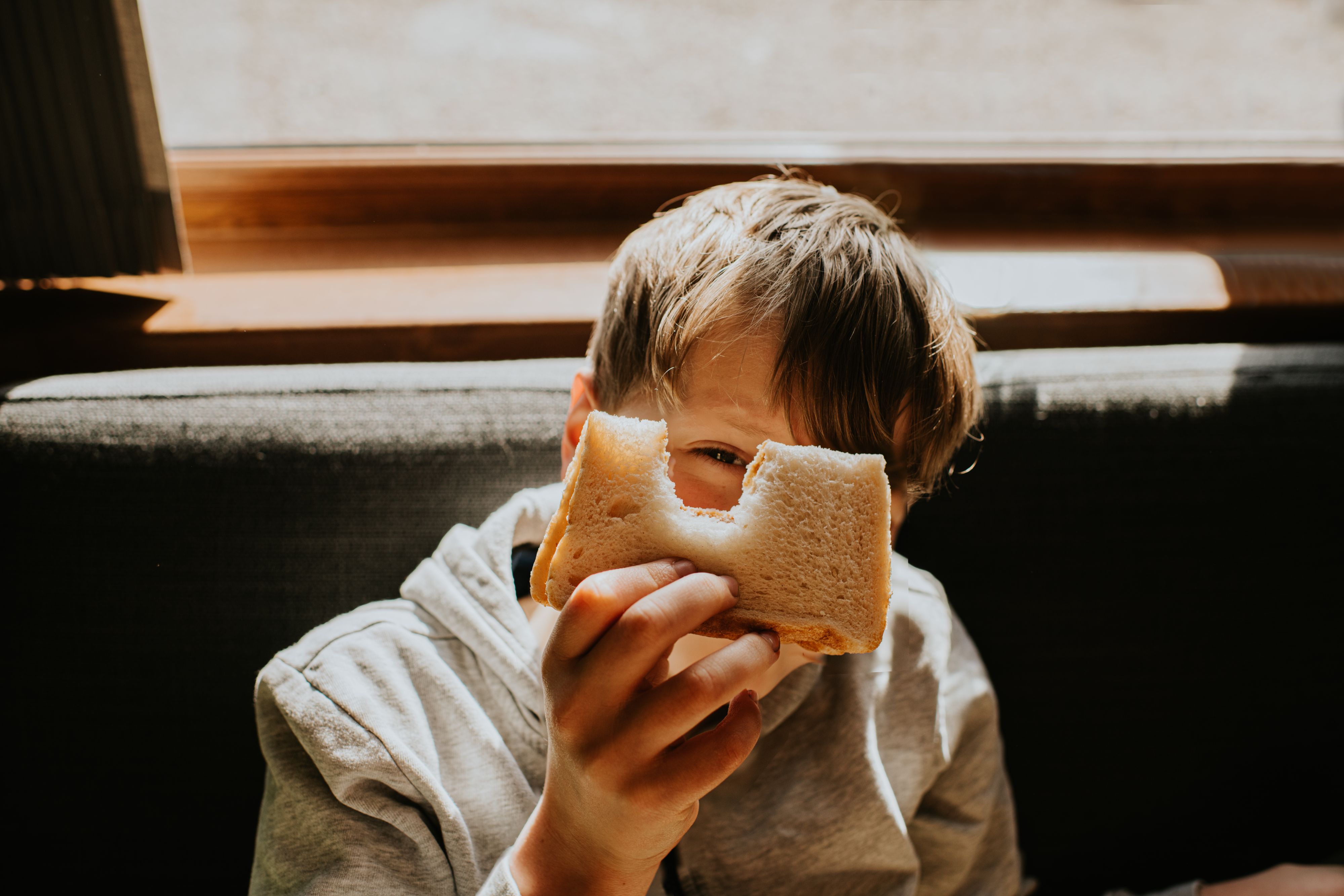 kid eating a sandwich