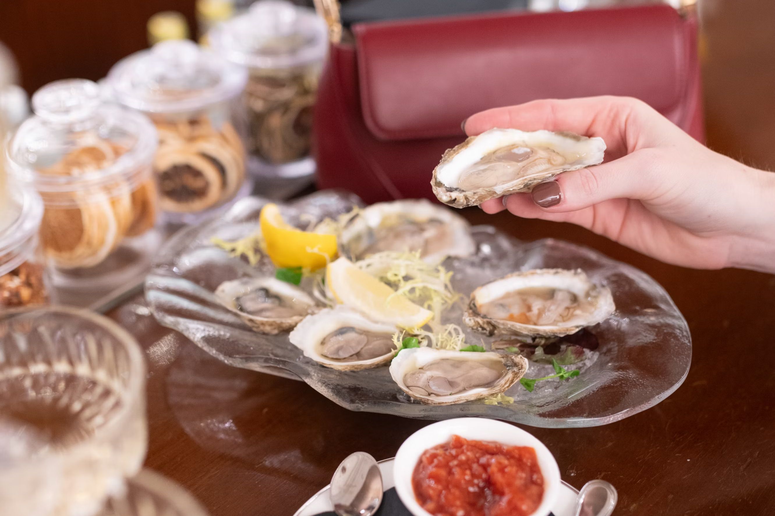 Oyster in front of purse