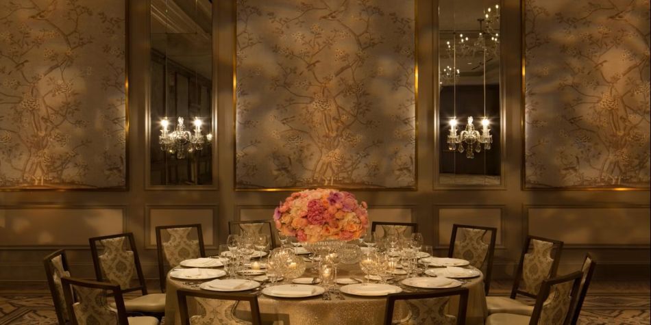 Round table set up for a reception with florals and eatery.