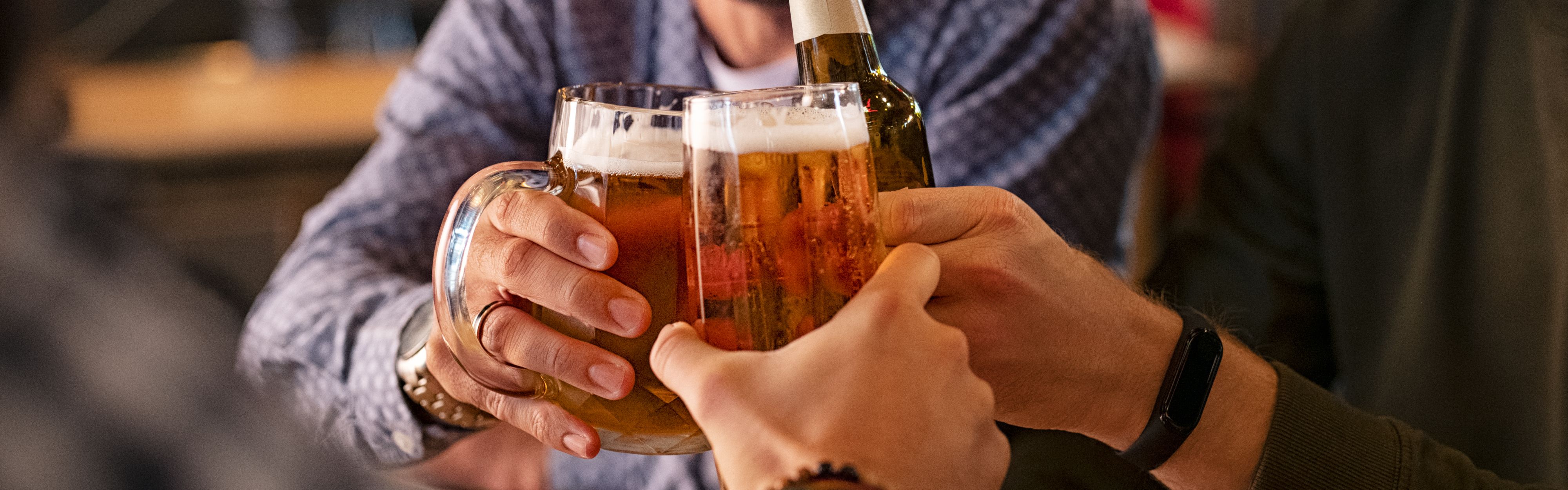 men cheersing with beers