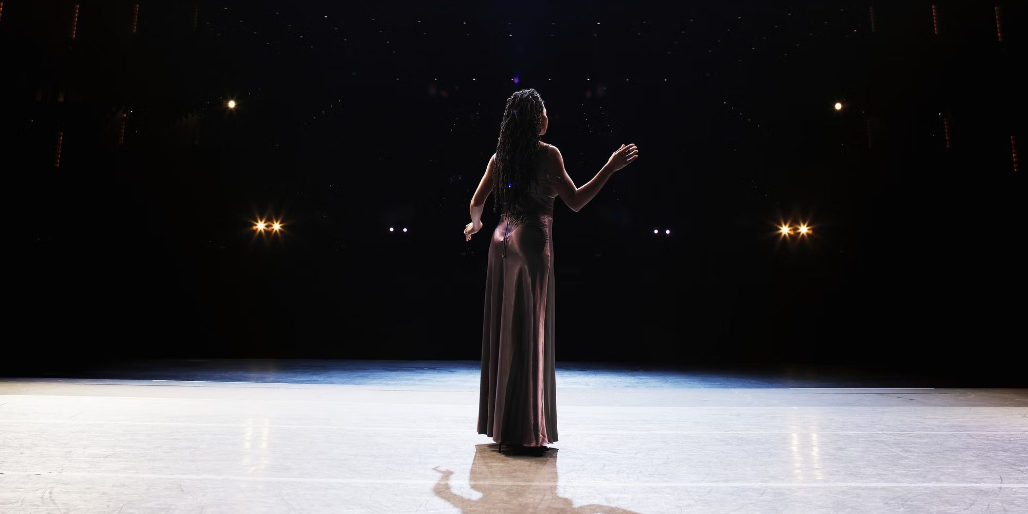 Woman performing on stage at a broadway show
