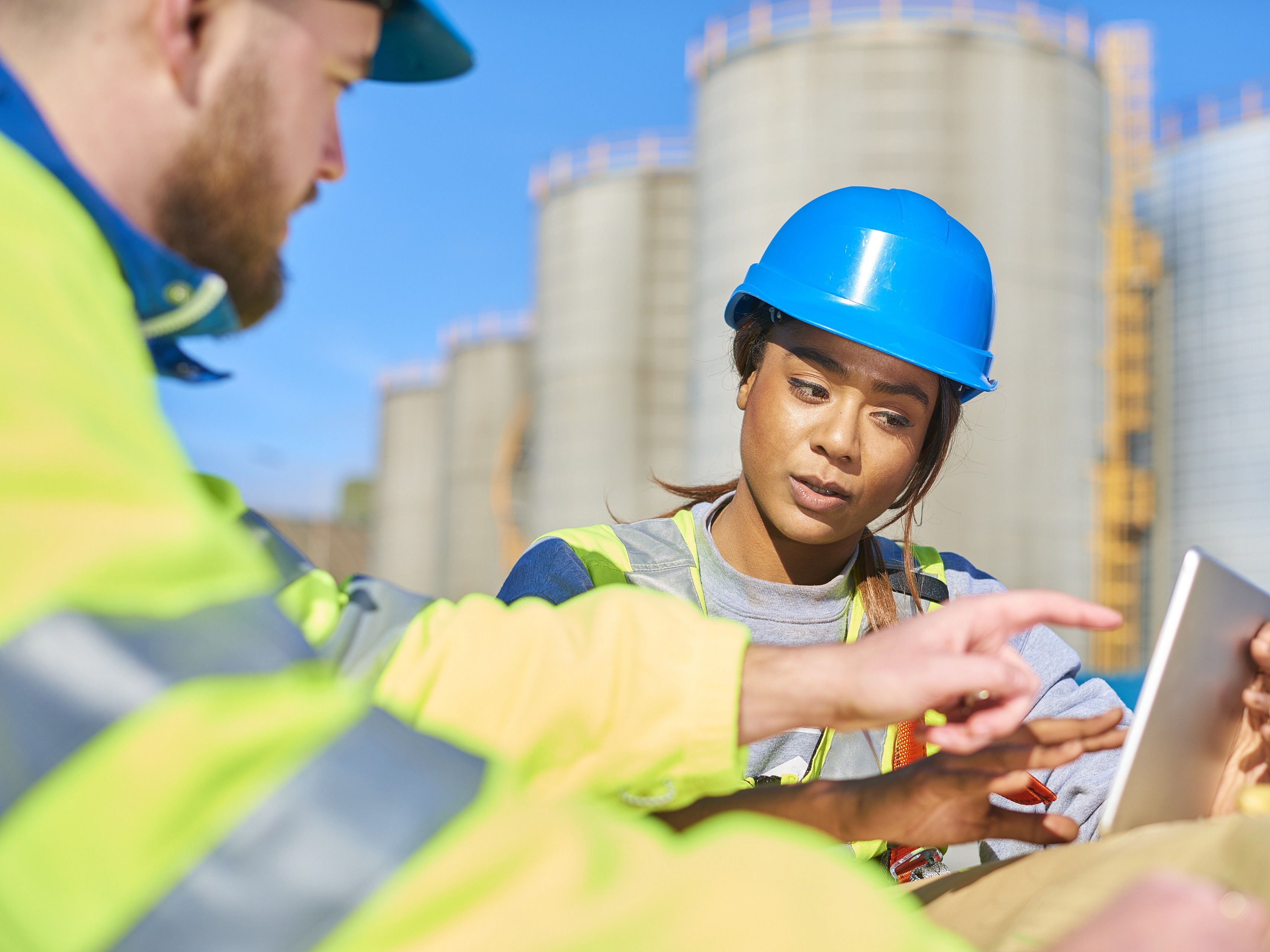 Construction workers looking at a screen