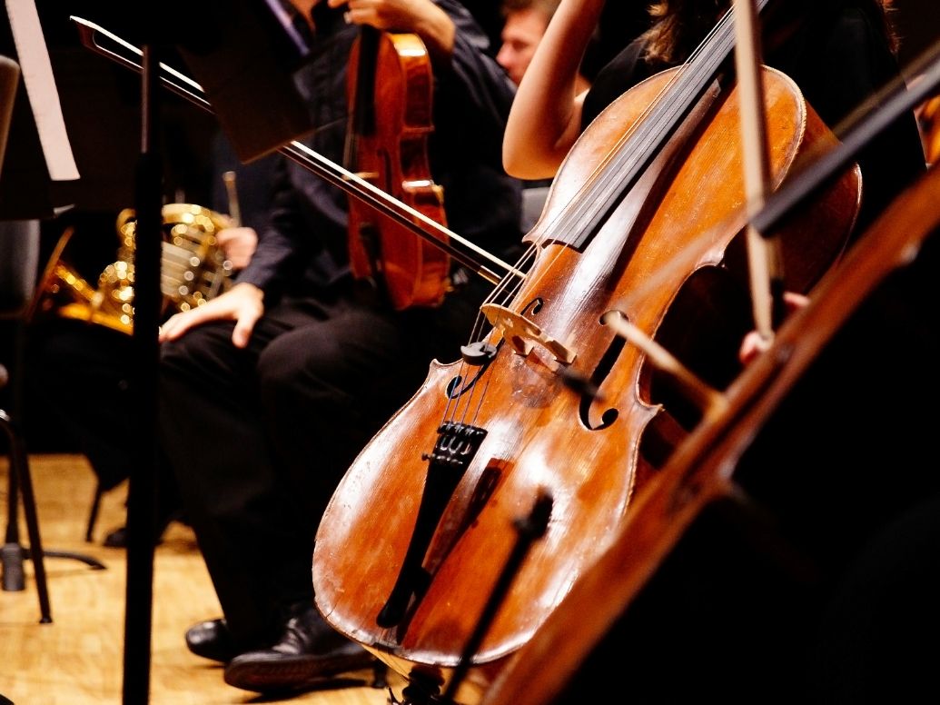 Orchestra with violin and chair