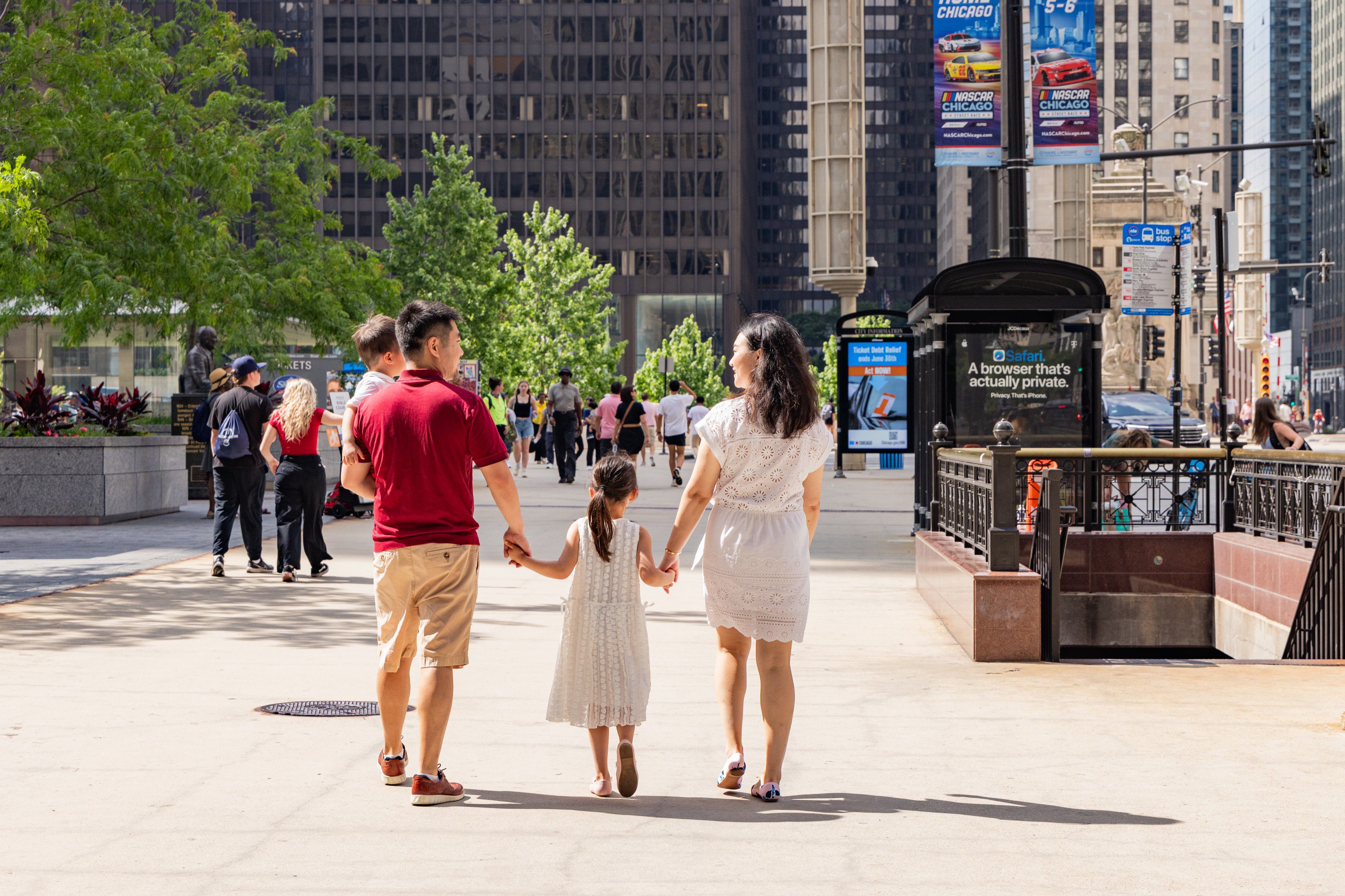 Guests walking along a downtown Chicago sidewalk.