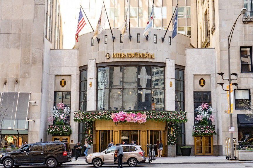 InterContinental Chicago Magnificent Mile hotel entrance decorated with floral displays