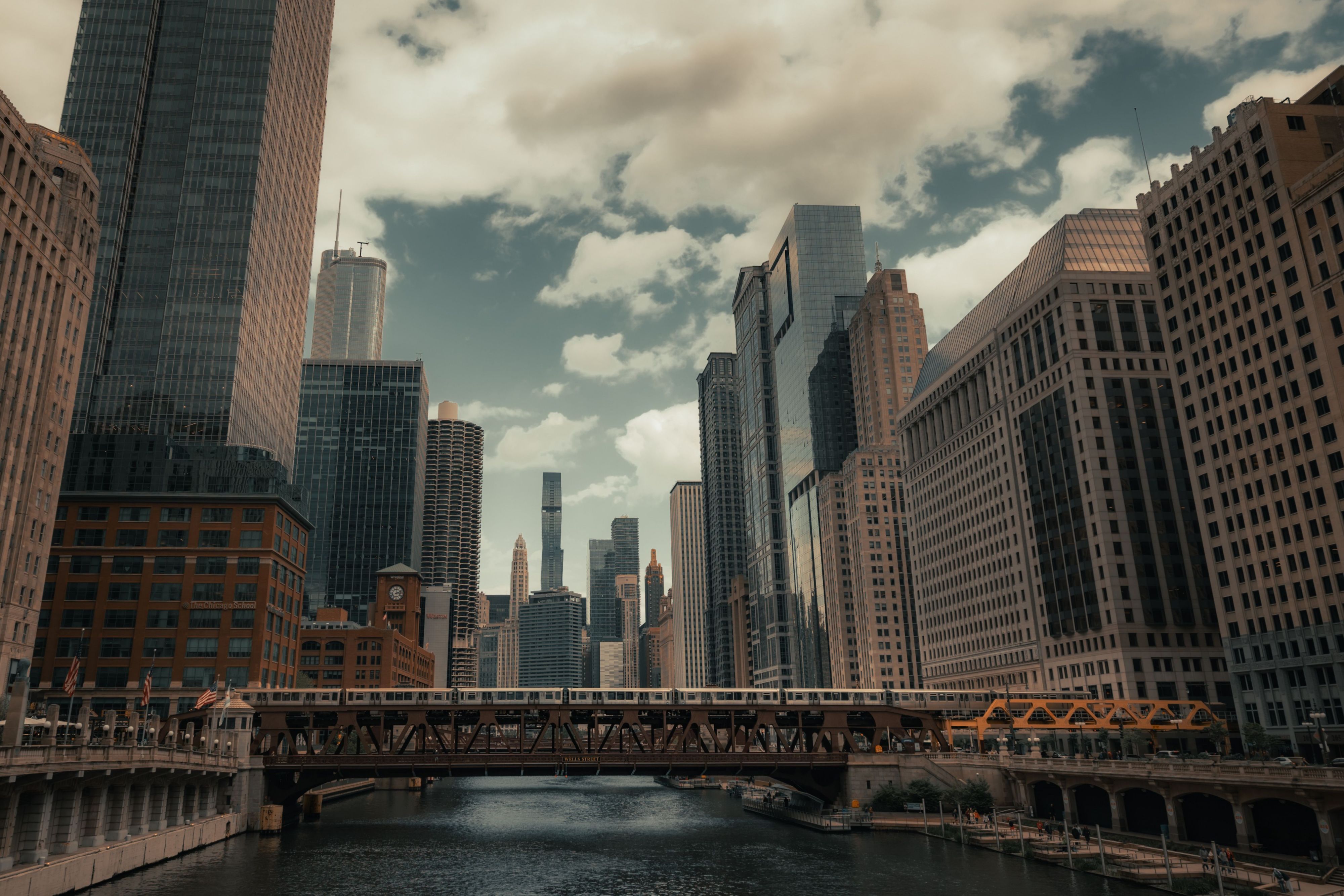 Chicago Riverwalk with river, bridges, and downtown skyscrapers