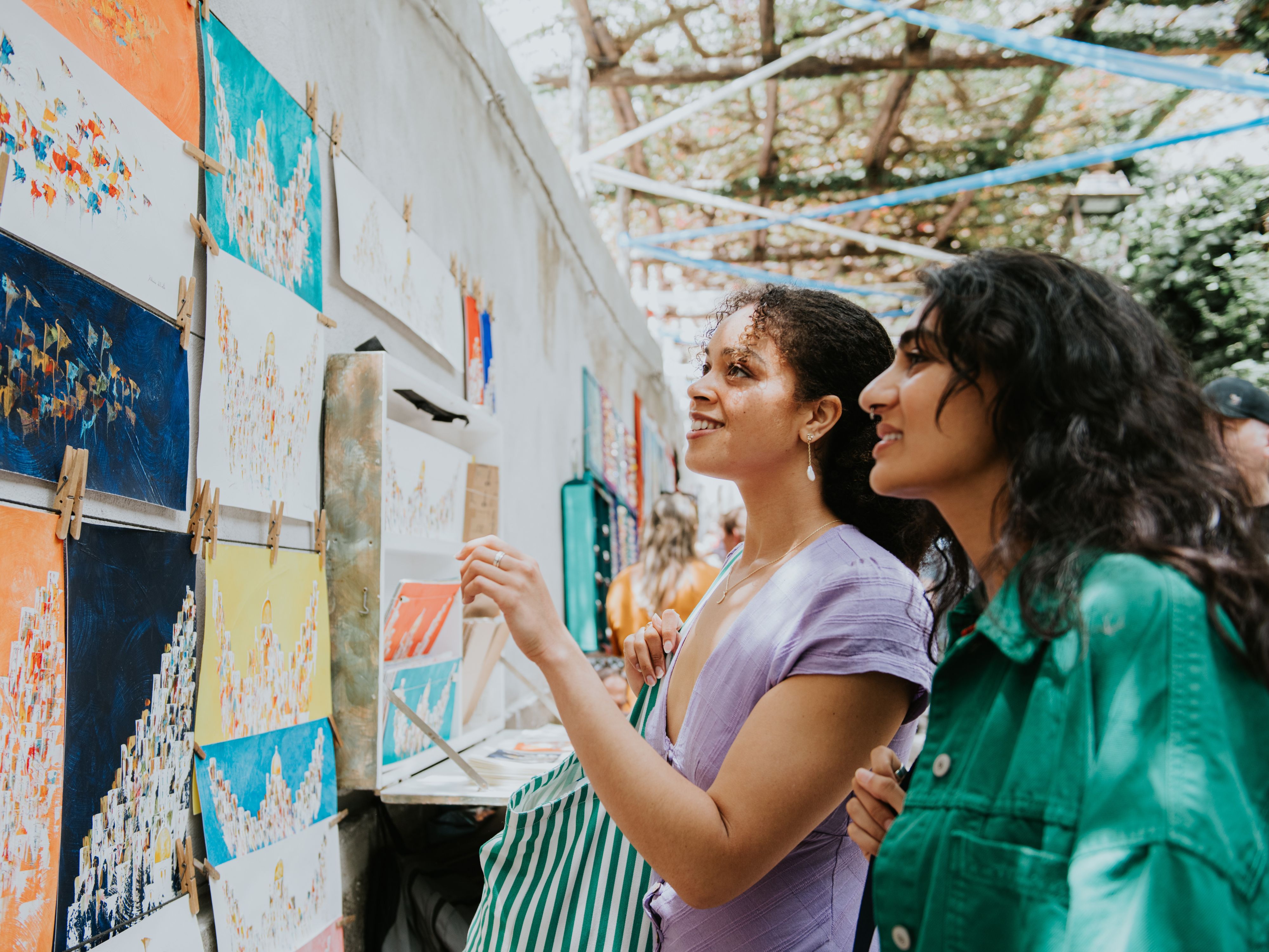 Friends attending an outdoor arts festival