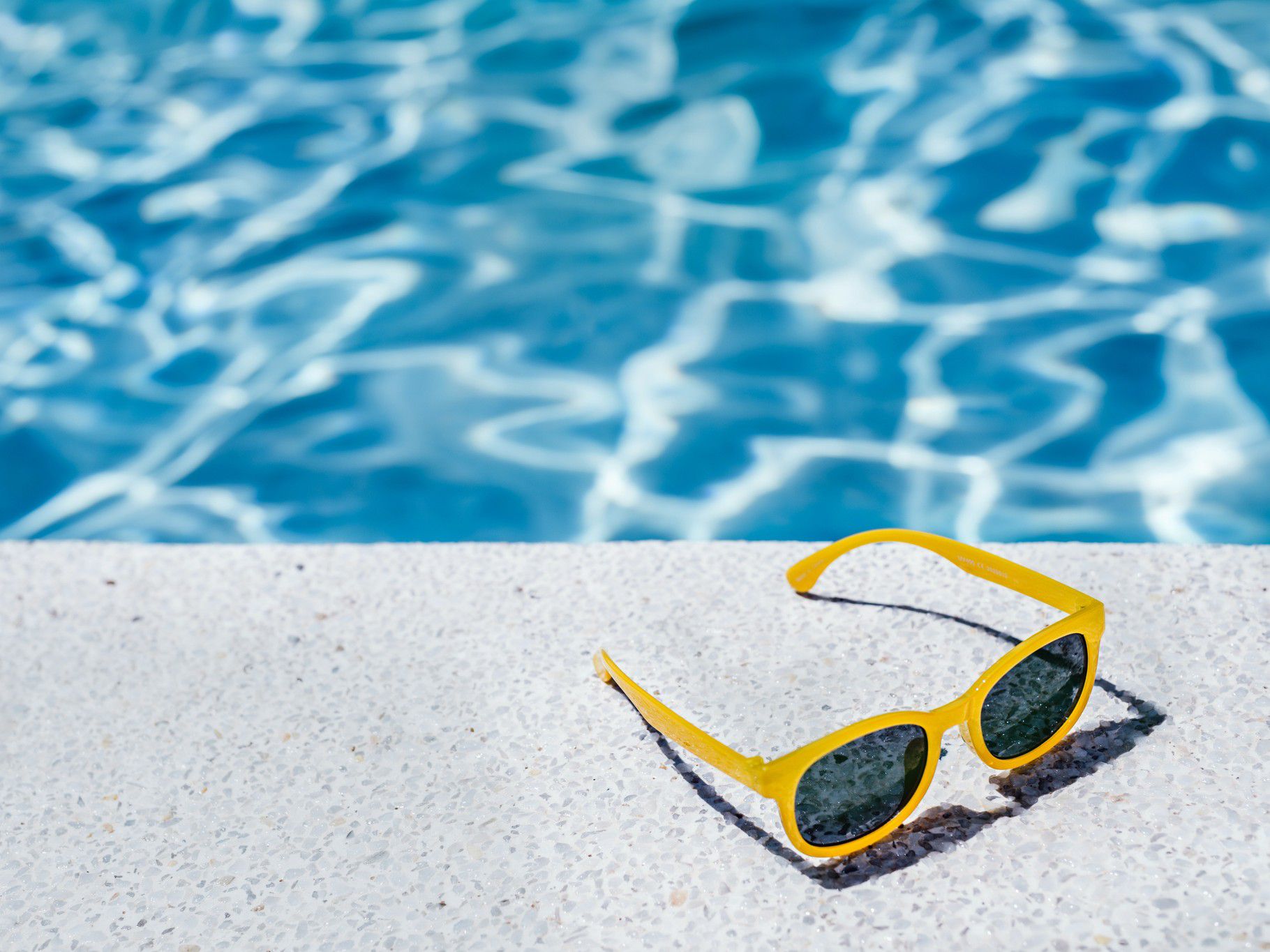 outdoor pool with sunglasses