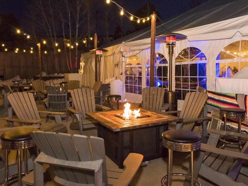Outdoor courtyard space with fire pit and chairs