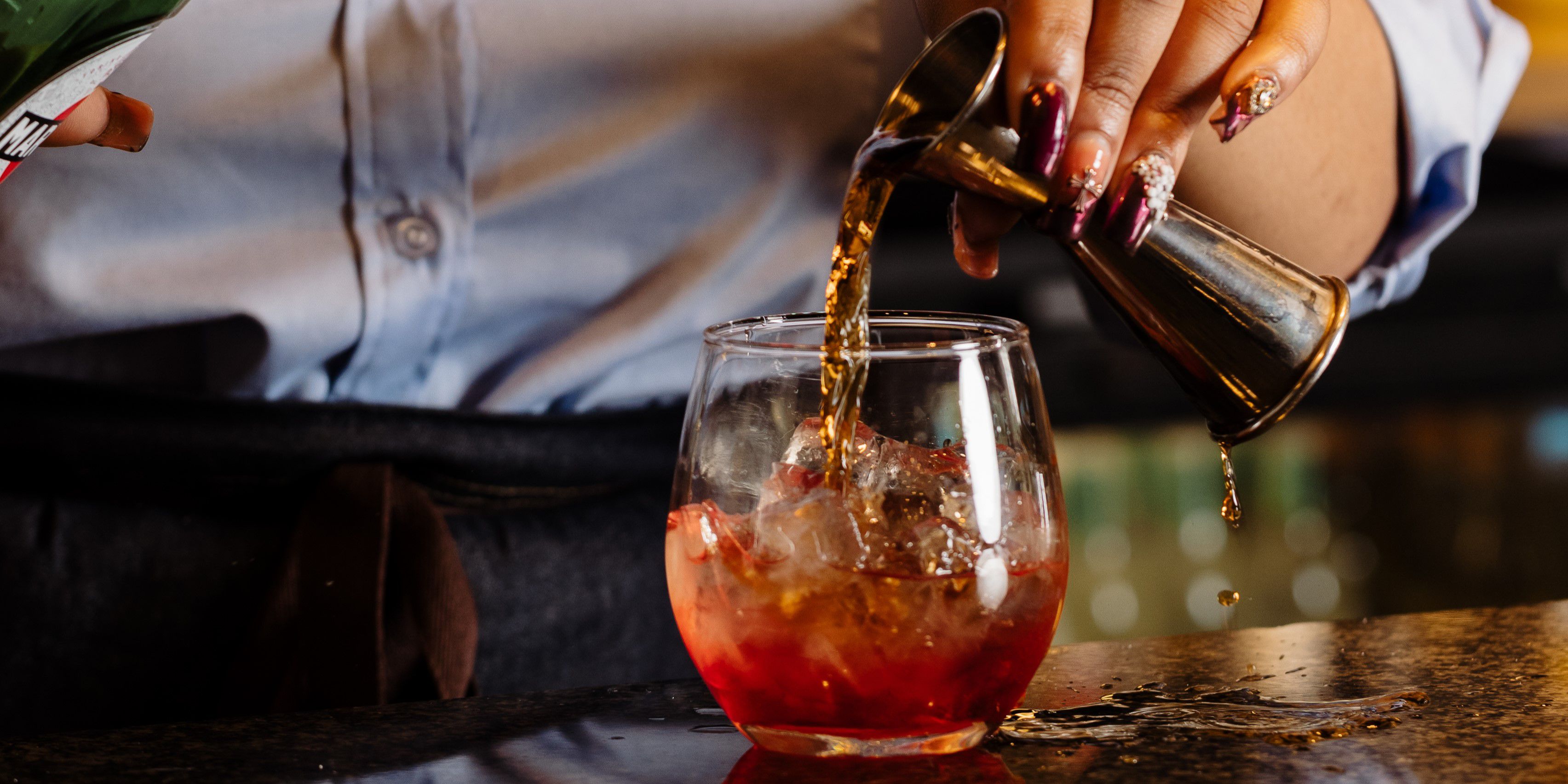 Bartender pouring a drink