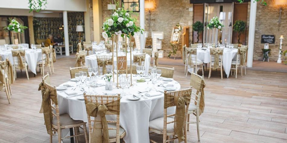 large wedding space with round tables