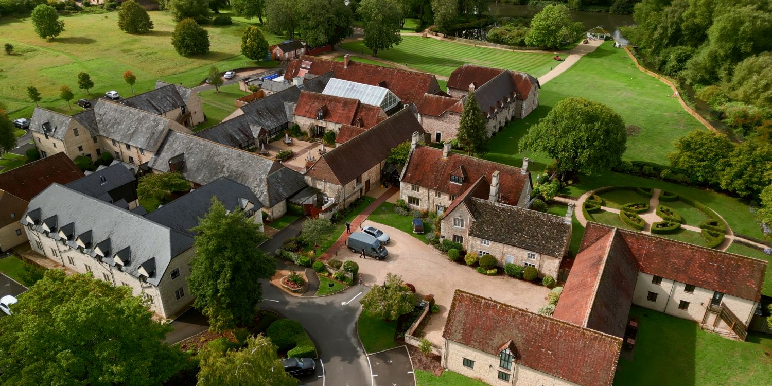 aerial view over hotel showing lots of surrounding greenery