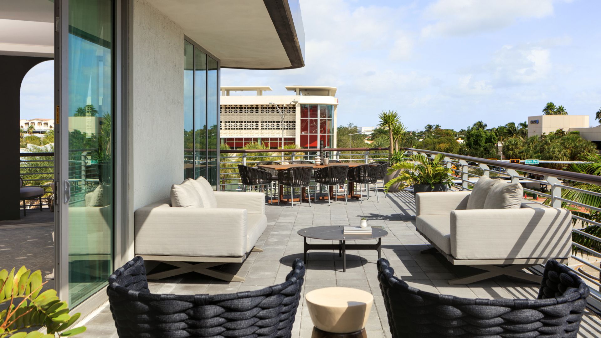 balcony on corner suite with outdoor dining table and miami south beach views