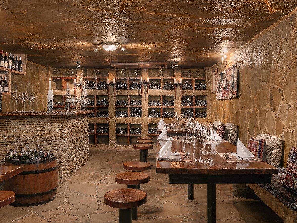 Rustic wine cellar restaurant with intimate dining ambiance
