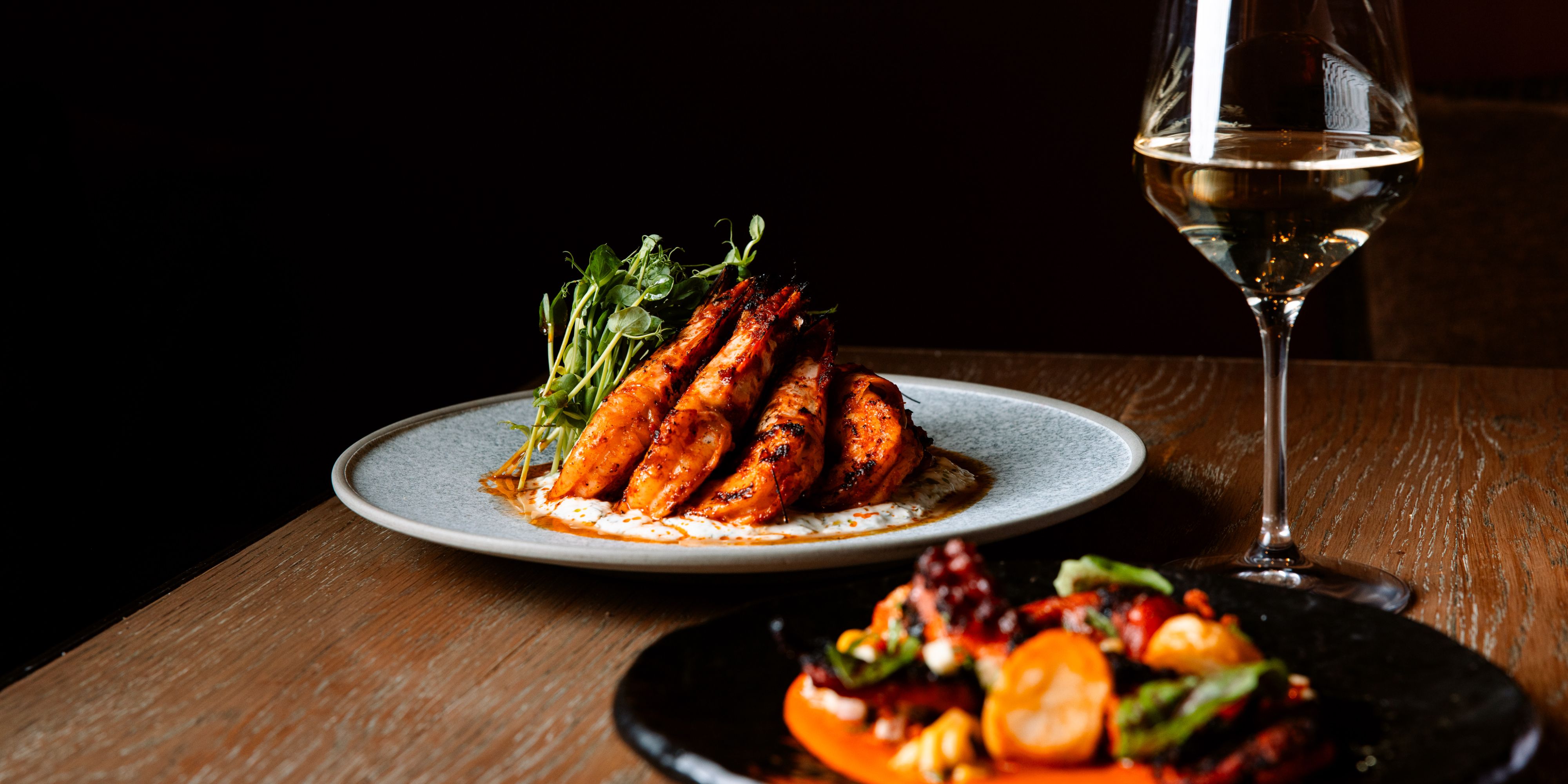 Dishes and wine from Ascua.