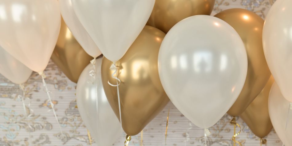 Gold and white balloons.
