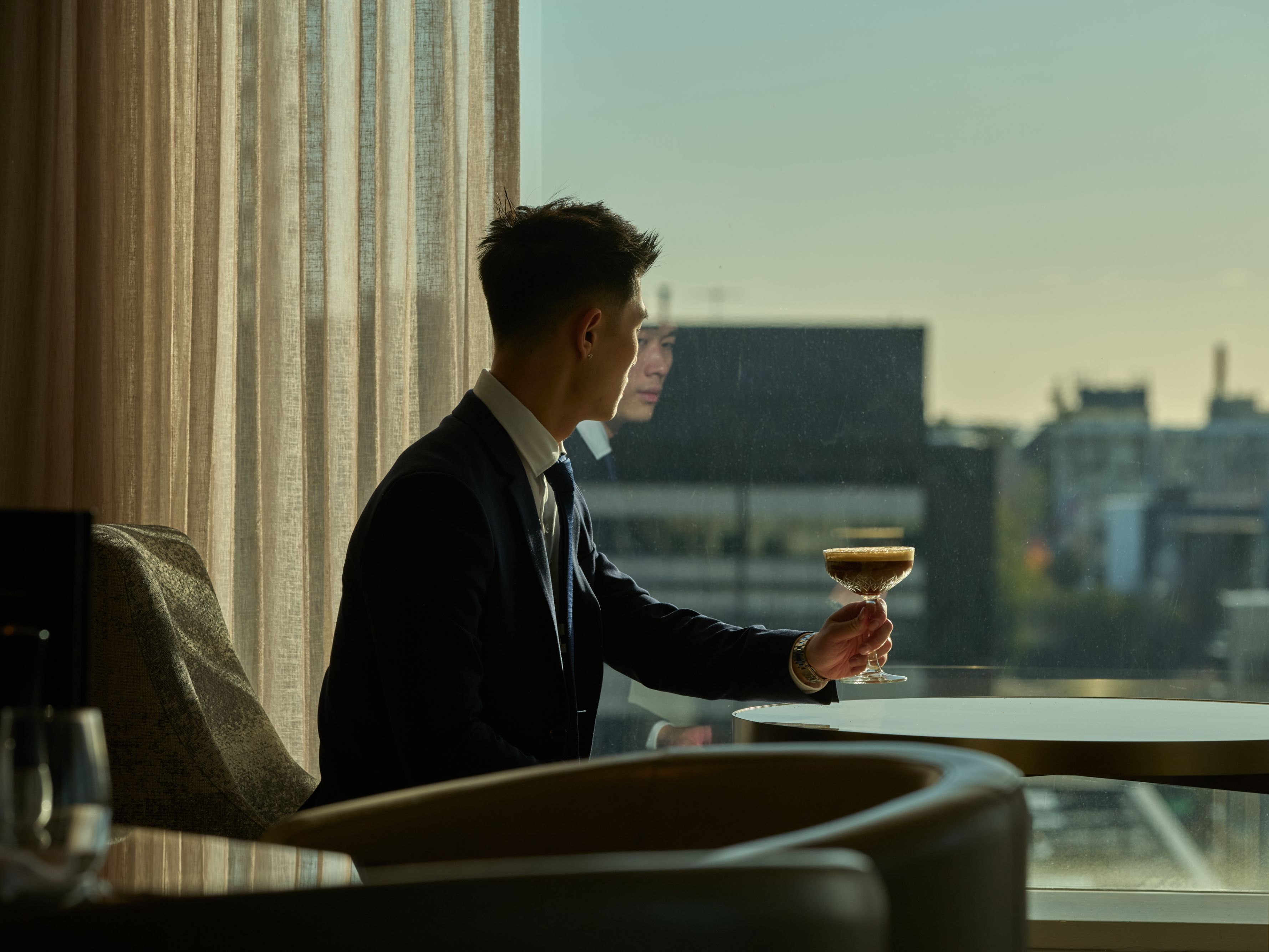Business man sitting in Club IC lounge.