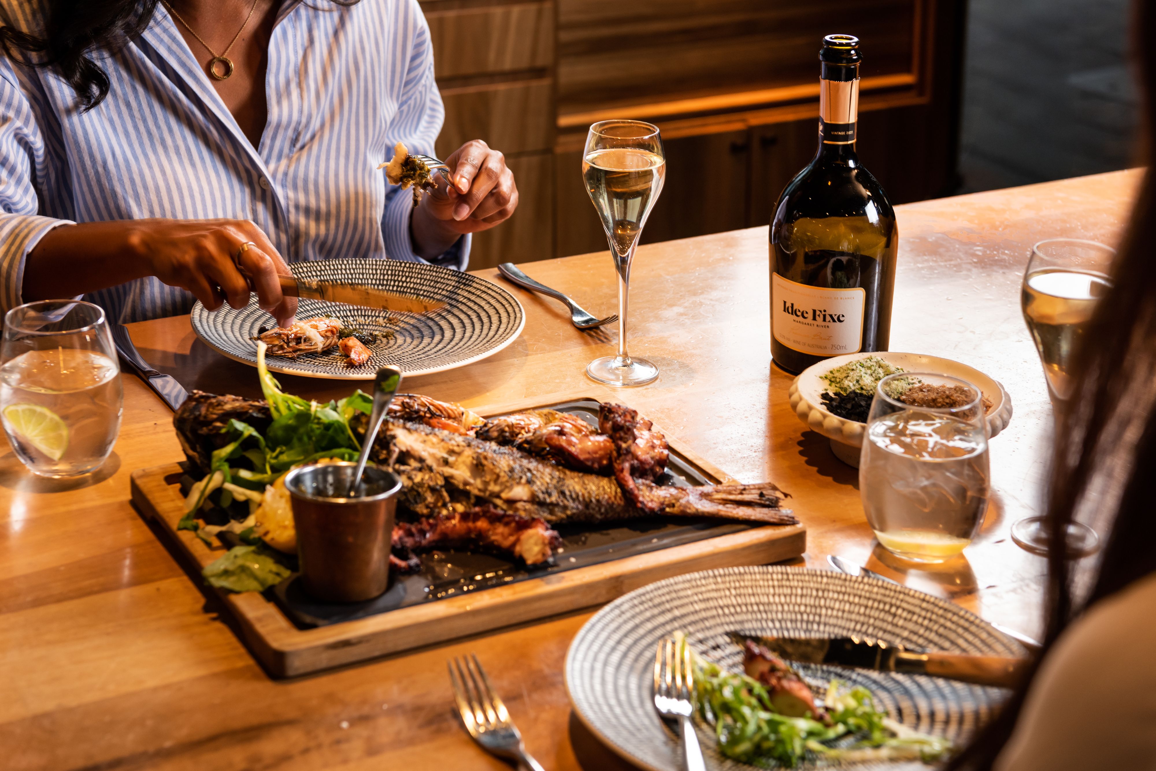 Guests dining at Ascua.