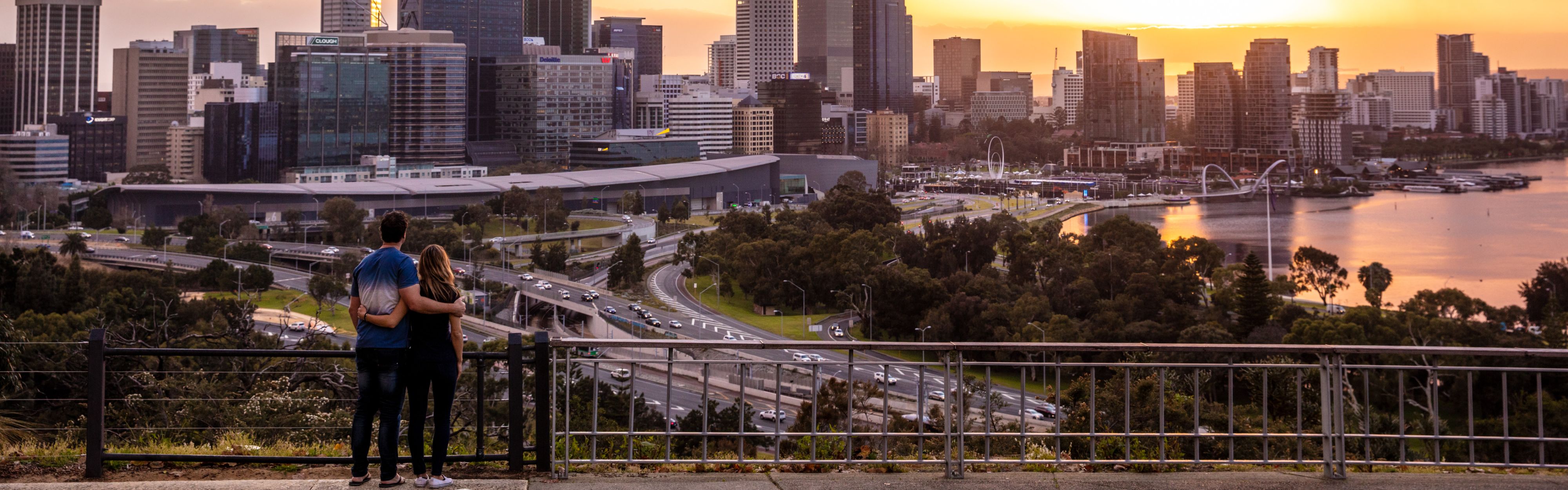 couple standing on bridge in Perth