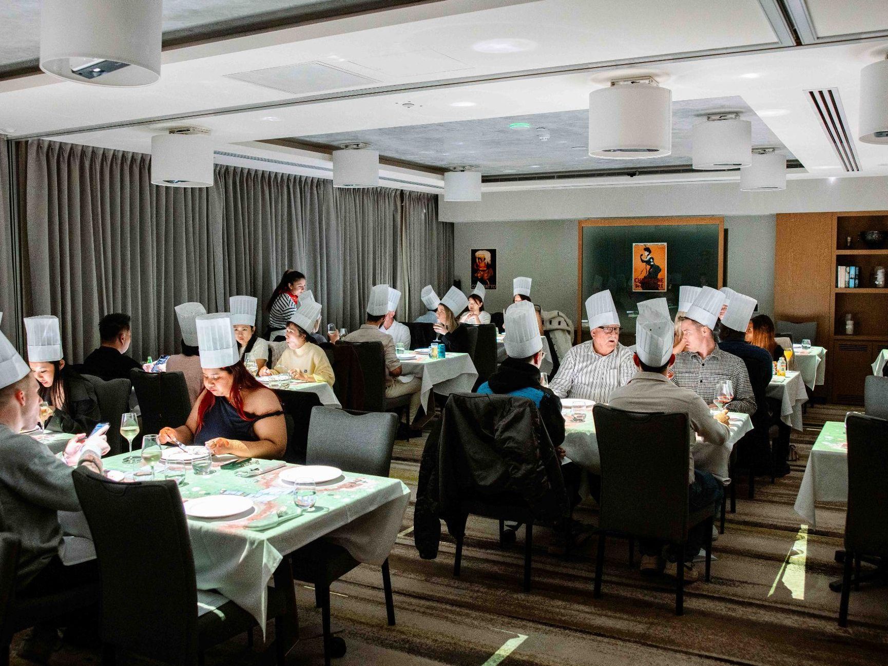 Diners wearing chef hats