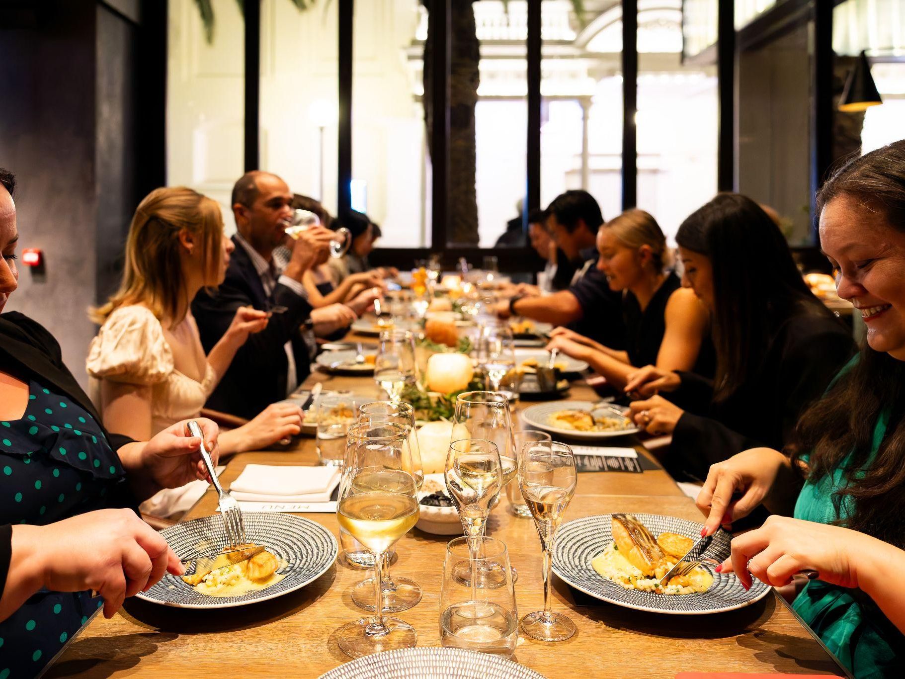 big group dining at Ascua