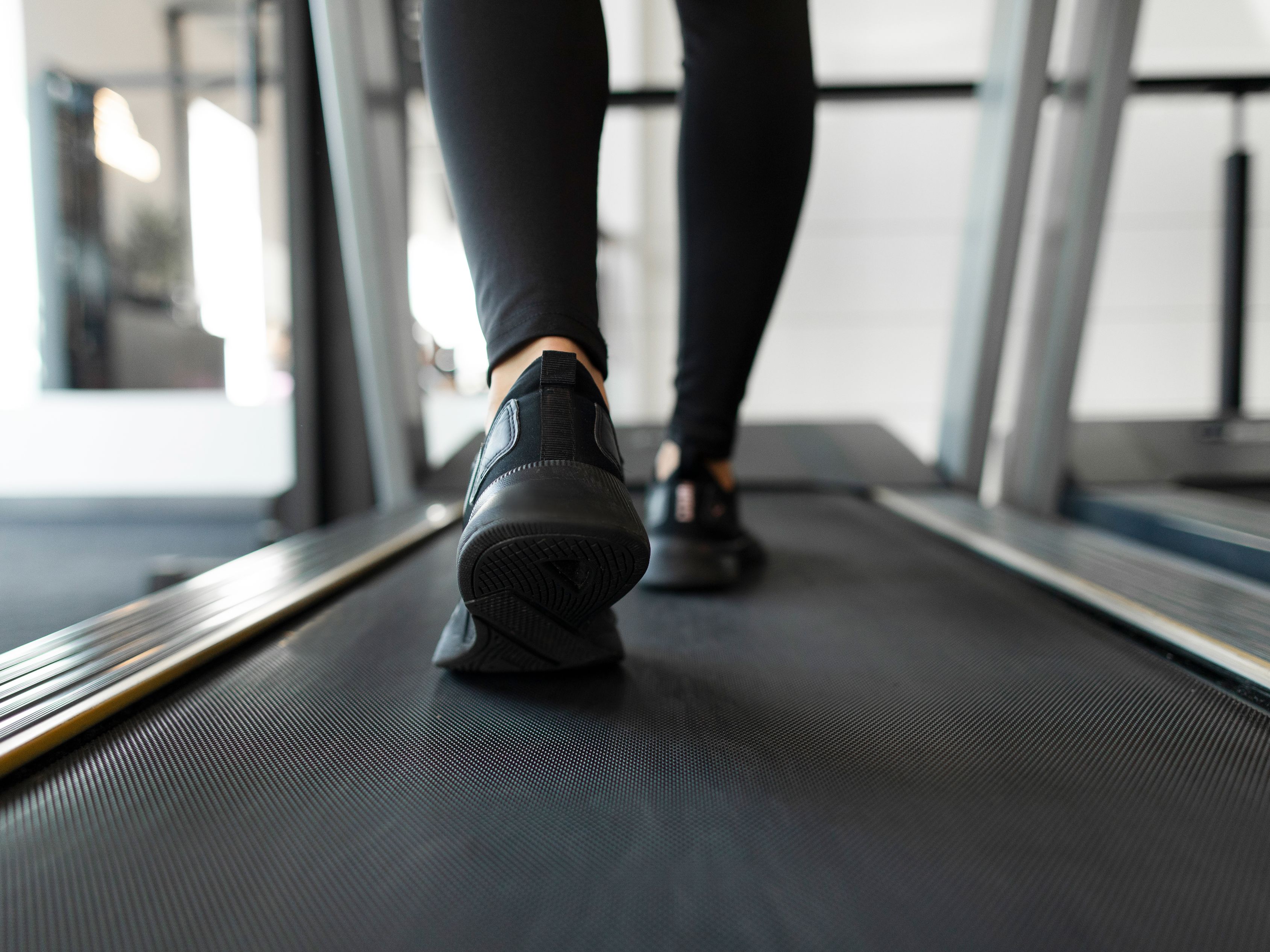 close up of sneakers on a treadmill