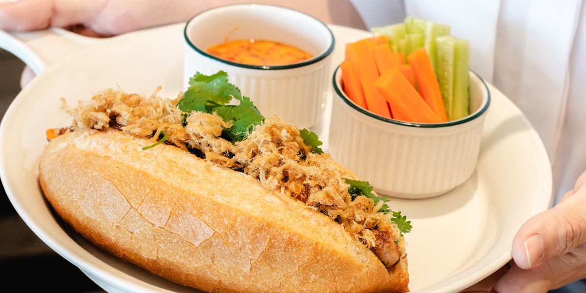 Banh mi sandwich with vegetables and dipping sauce