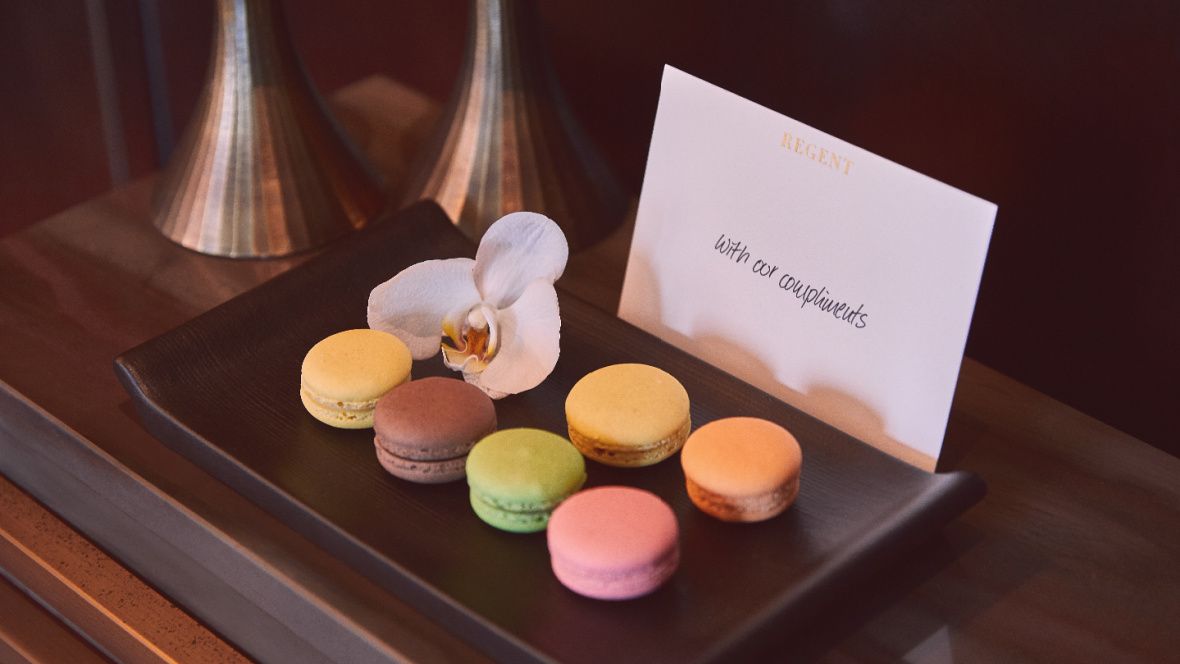 plate of colorful macaroons on table