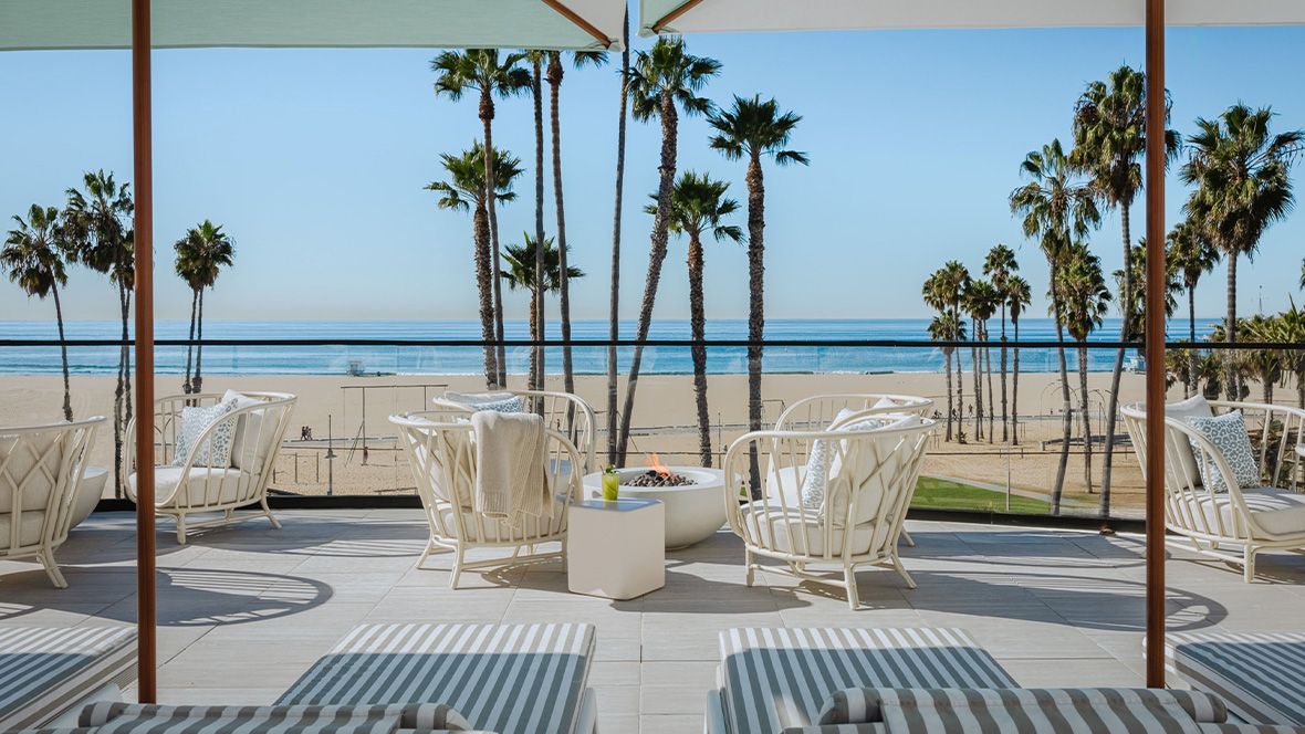 outdoor seating and firepit overlooking the beach and ocean