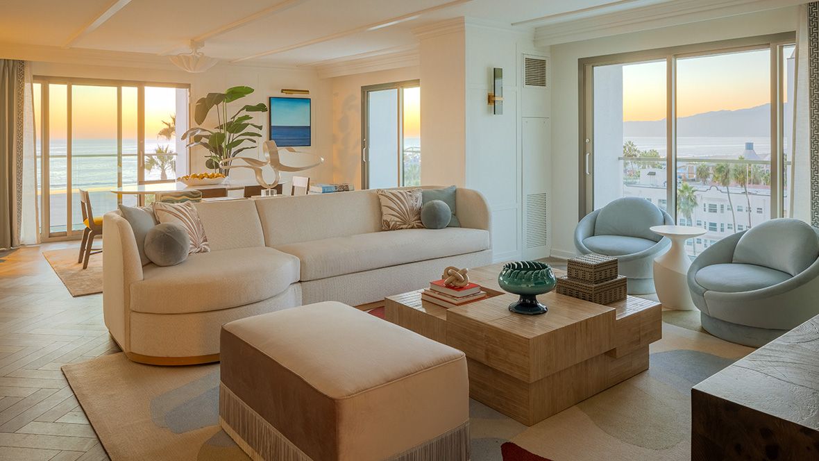 beautiful suite overlooking the pacific ocean bathed in light at sunset