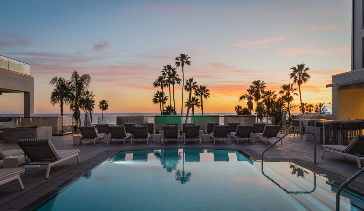 Regent Santa Monica swimming pool surrounded by palm trees