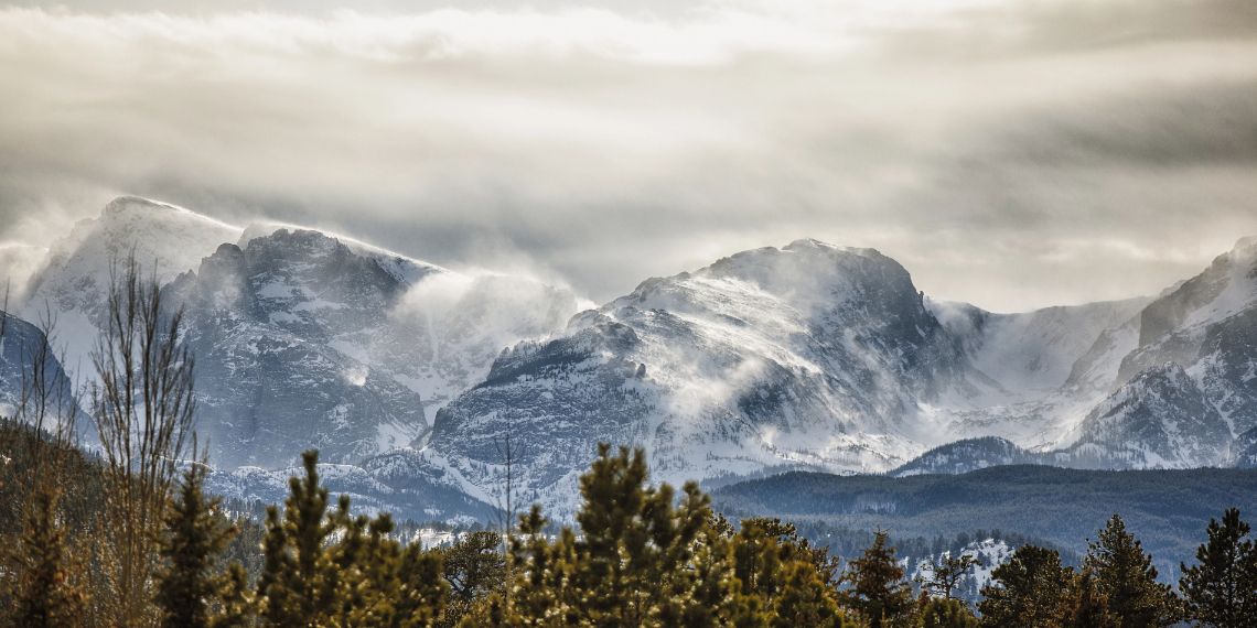Guests enjoying drinks around outdoor fire pit