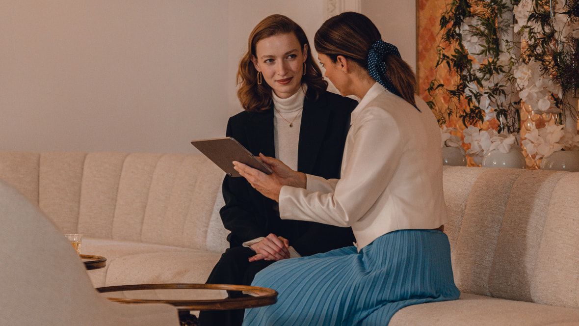 two people talking on a couch