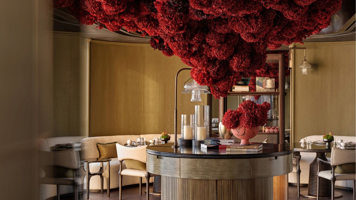 dramatic sculptural floral installment above a table