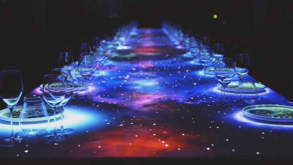 long table set with dramatic led light design